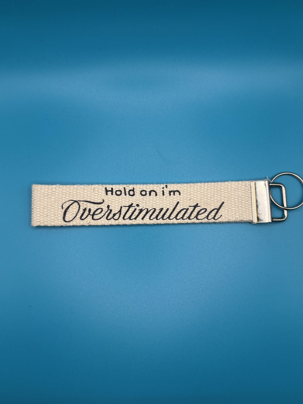 hold on i'm overstimulated keyring