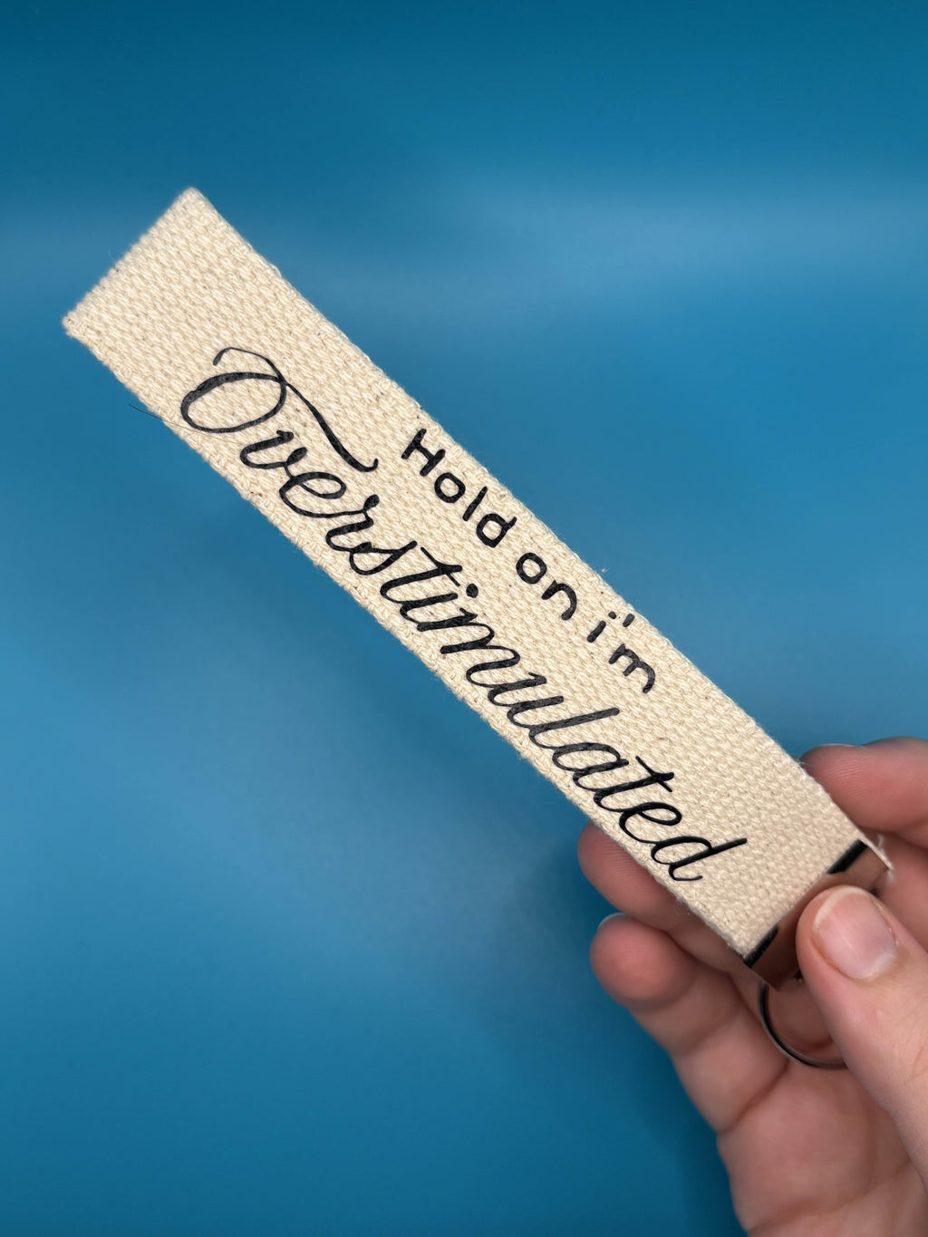 hold on i'm overstimulated keyring